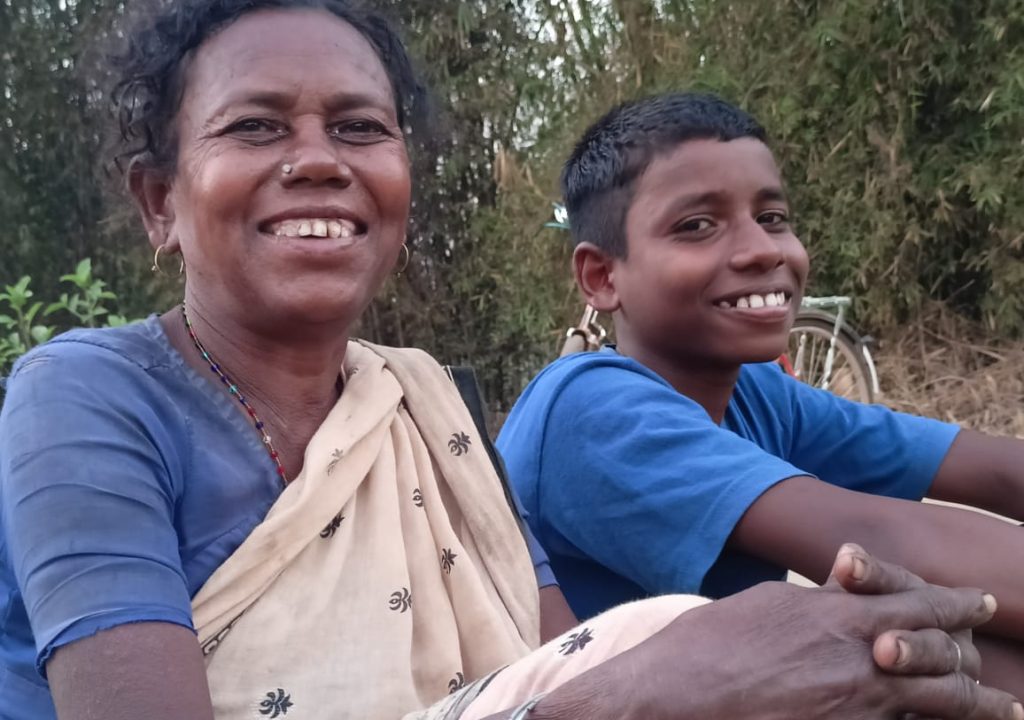 Jeet and his grand mother sitting next to each other and somiling